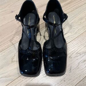 INTENTIONALLY BLANK Glossy Black T-Strap Heels
